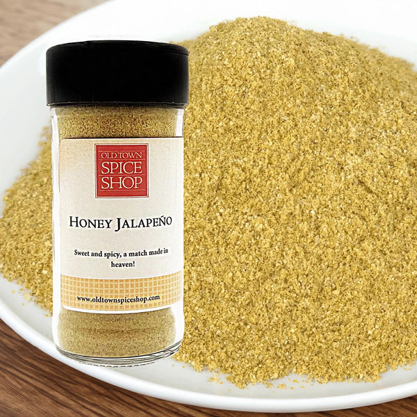 Jar of Old Town Spice Shop Honey Jalapeno spice on a plate with spice visible