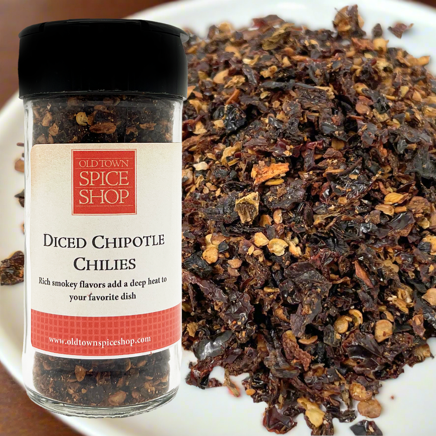 Bottle of Old Town Spice Shop Diced Chipotle Chilis with chilis on a plate