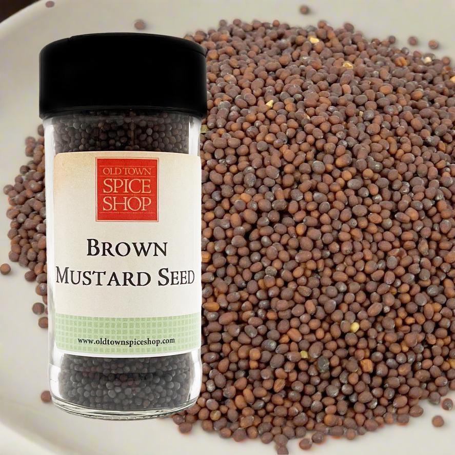 Bottle of Old Town Spice Shop Brown Mustard Seed with seeds in the background