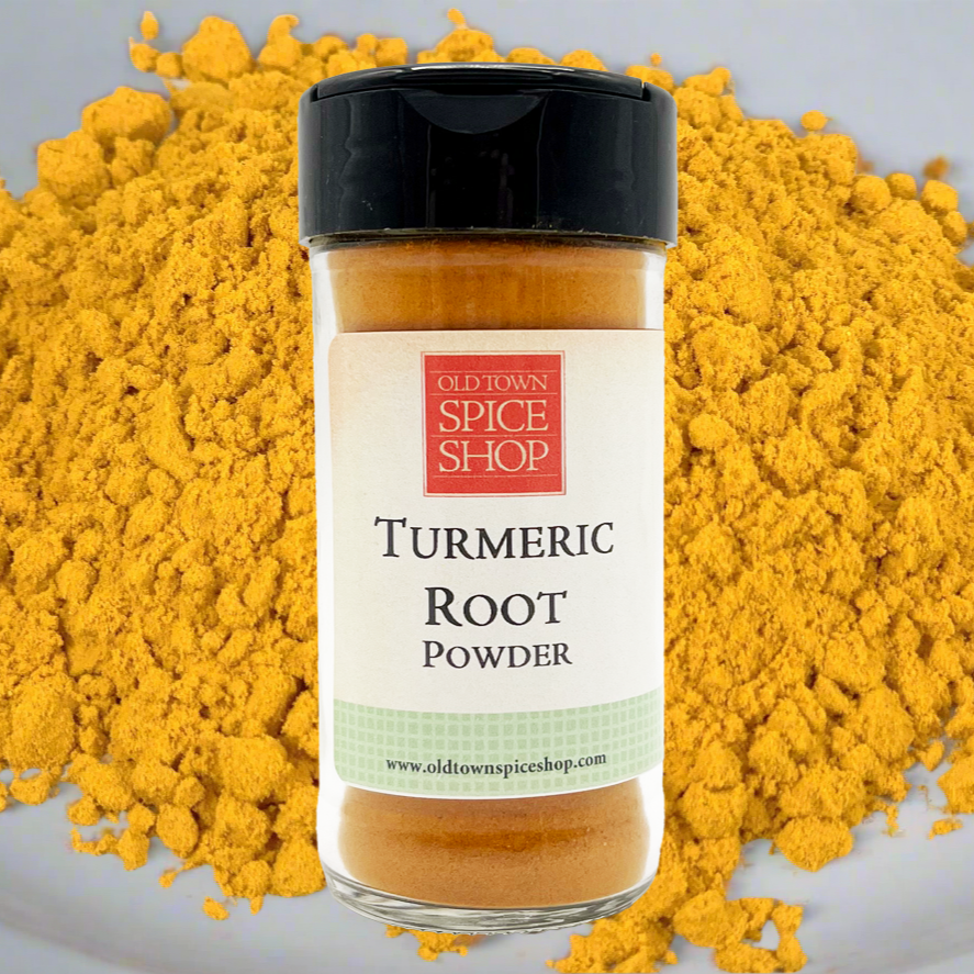 Bottle of Old Town Spice Shop Turmeric Root Powder surrounded by yellow powder on a gray background