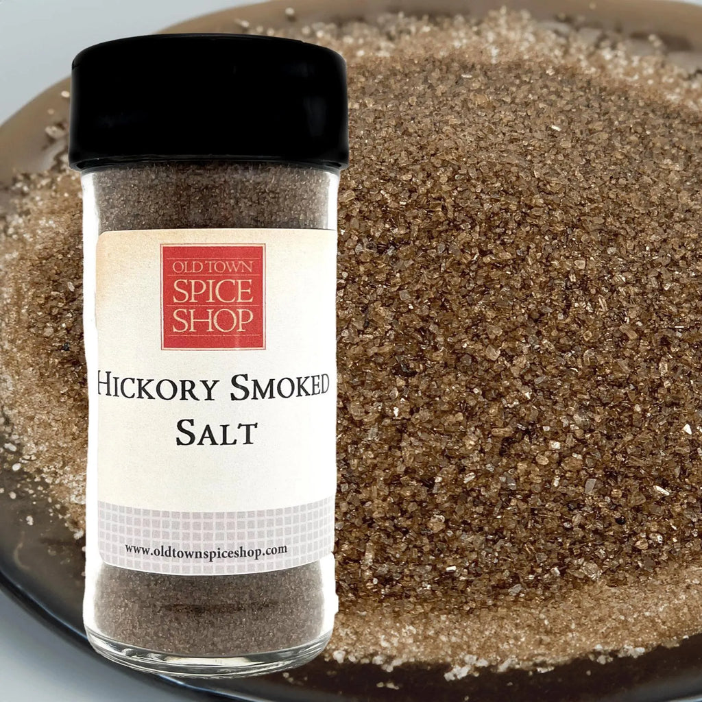 Jar of hickory smoked salt from Old Town Spice Shop on a plate with salt crystals.