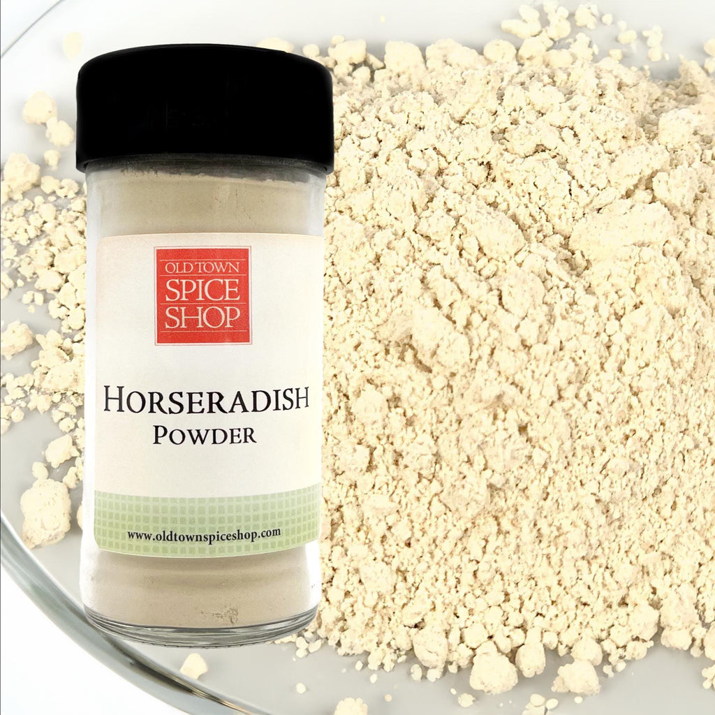 Jar of horseradish powder from Old Town Spice Shop on a plate with horseradish powder.