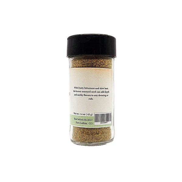 Spice jar with black lid and label on a white background