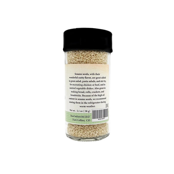 Jar of sesame seeds with a label on a white background