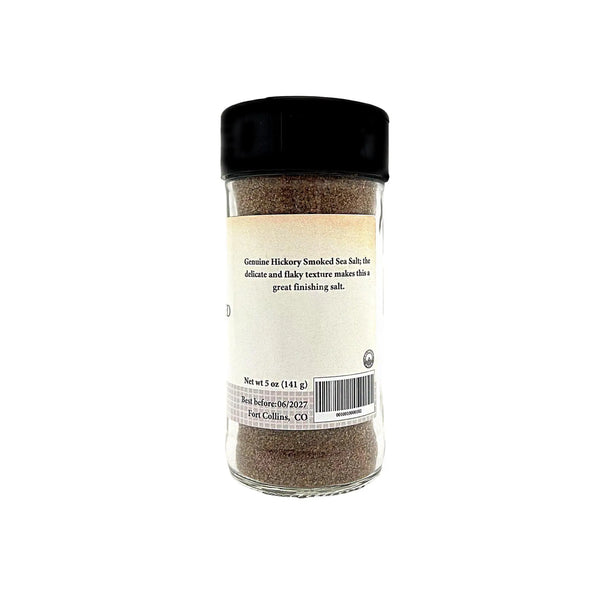 Jar of genuine hickory smoked sea salt on a white background