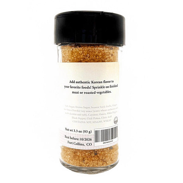 Spice jar with black lid and label on a white background