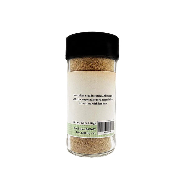 Spice jar with black lid on a white background
