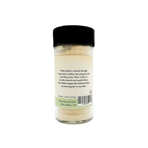 Jar of garlic powder with a black lid on a white background