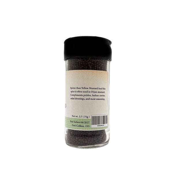 Spice jar with black lid and label on a white background