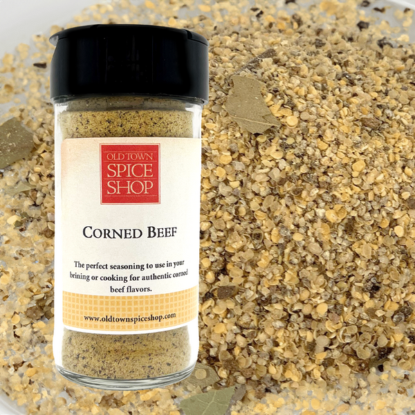 Jar of Old Town Spice Shop Corned Beef seasoning with a close-up of the seasoning in the background.