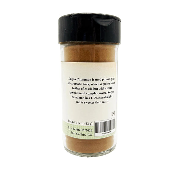 Spice jar with black lid and label on a white background