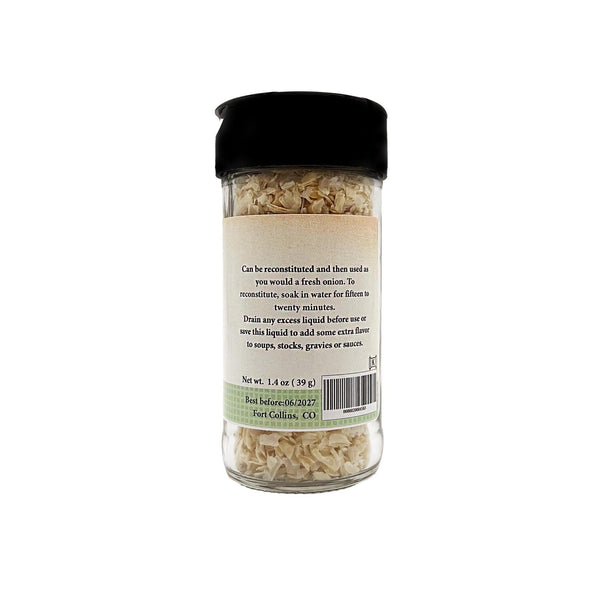 Jar of dried onions with a label on a white background