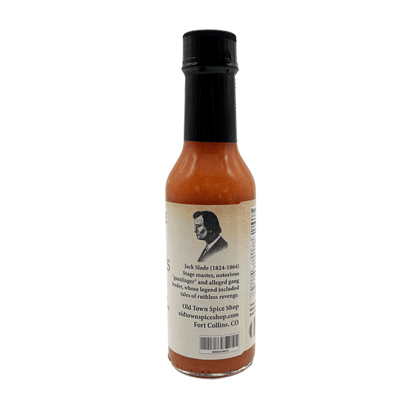 Hot sauce bottle with a label featuring a portrait on a white background