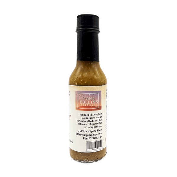 Bottle of Fort Collins hot sauce on a white background