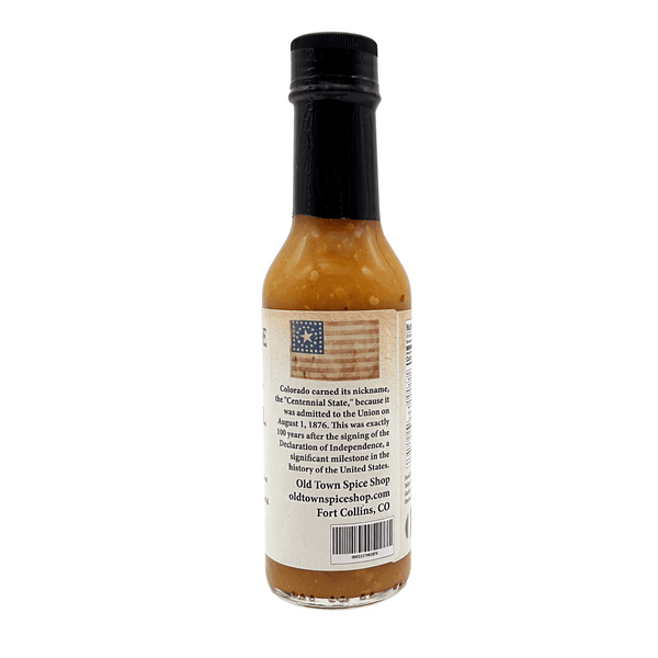 Hot sauce bottle with label on a white background