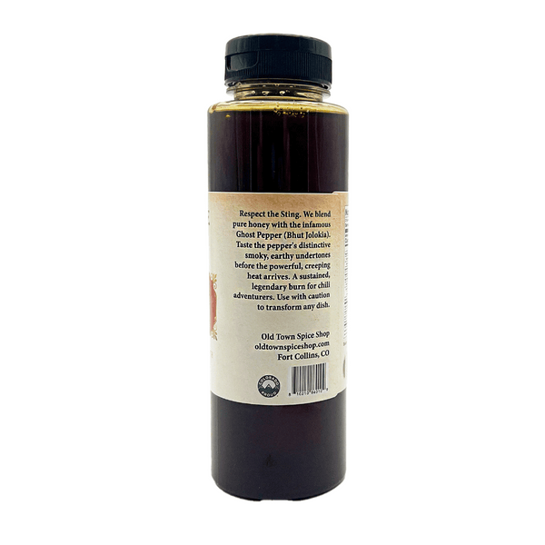 Bottle of hot sauce with a label on a white background