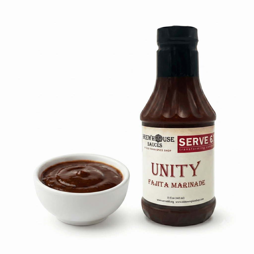 Bottle and bowl of Unity Fajita Marinade from Serve & Share on a white background