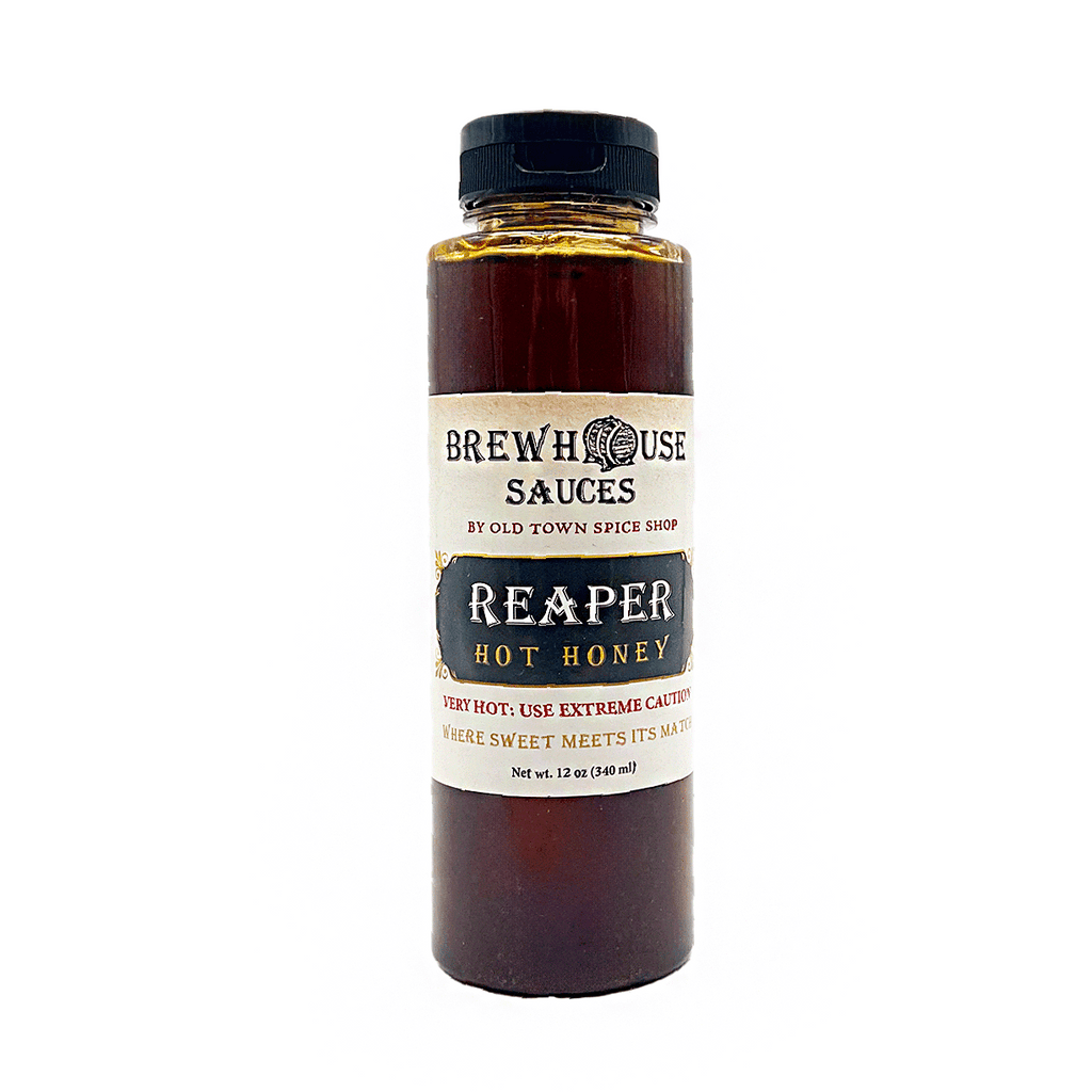 Bottle of Reaper Hot Honey from BrewHouse Sauces on a white background