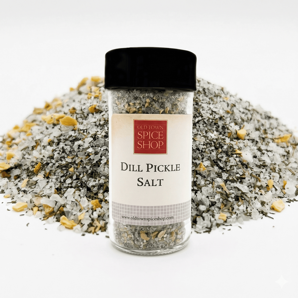 Jar of Dill Pickle Salt from Old Town Spice Shop with a pile of salt in the background.
