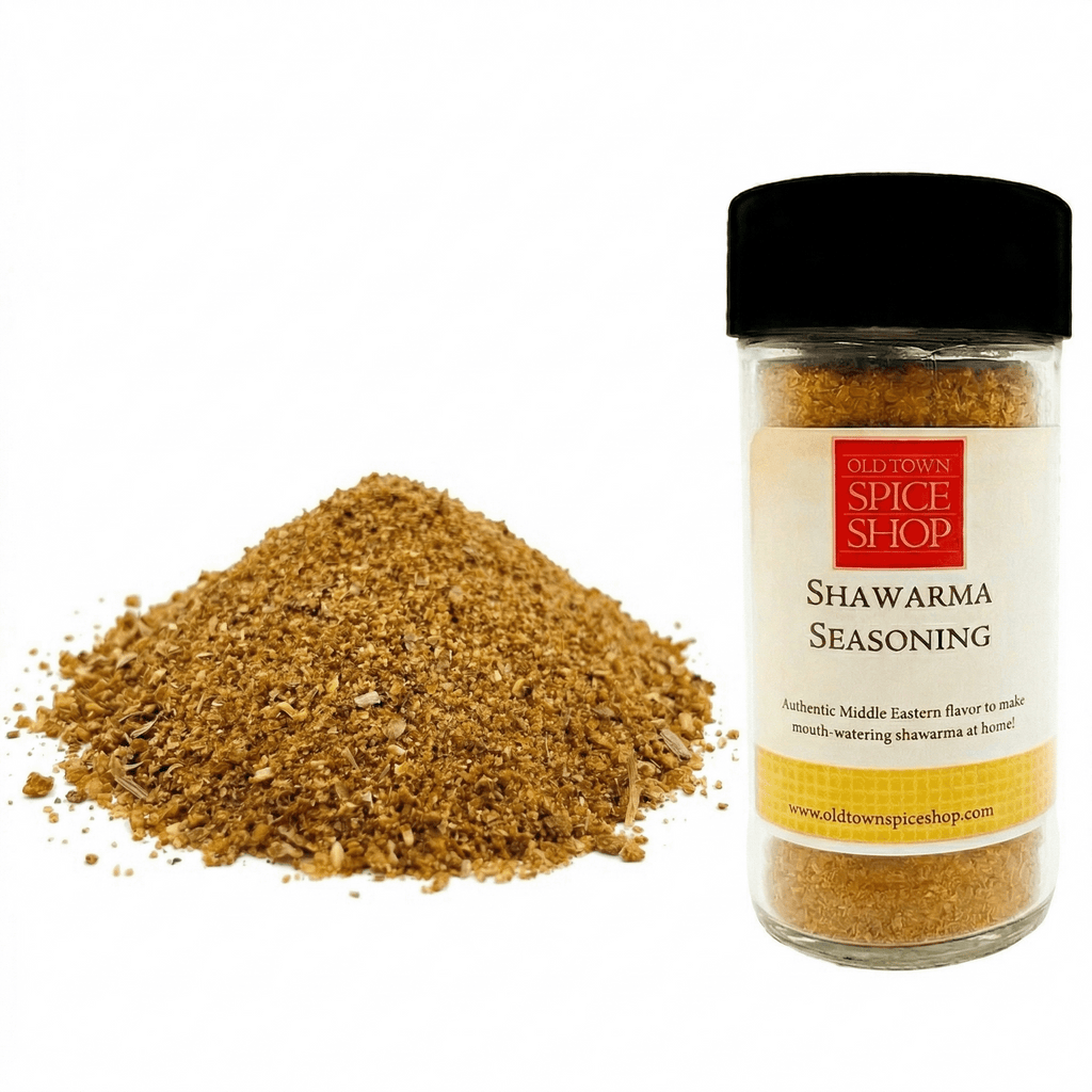 Shawarma seasoning jar with a pile of seasoning on a white background