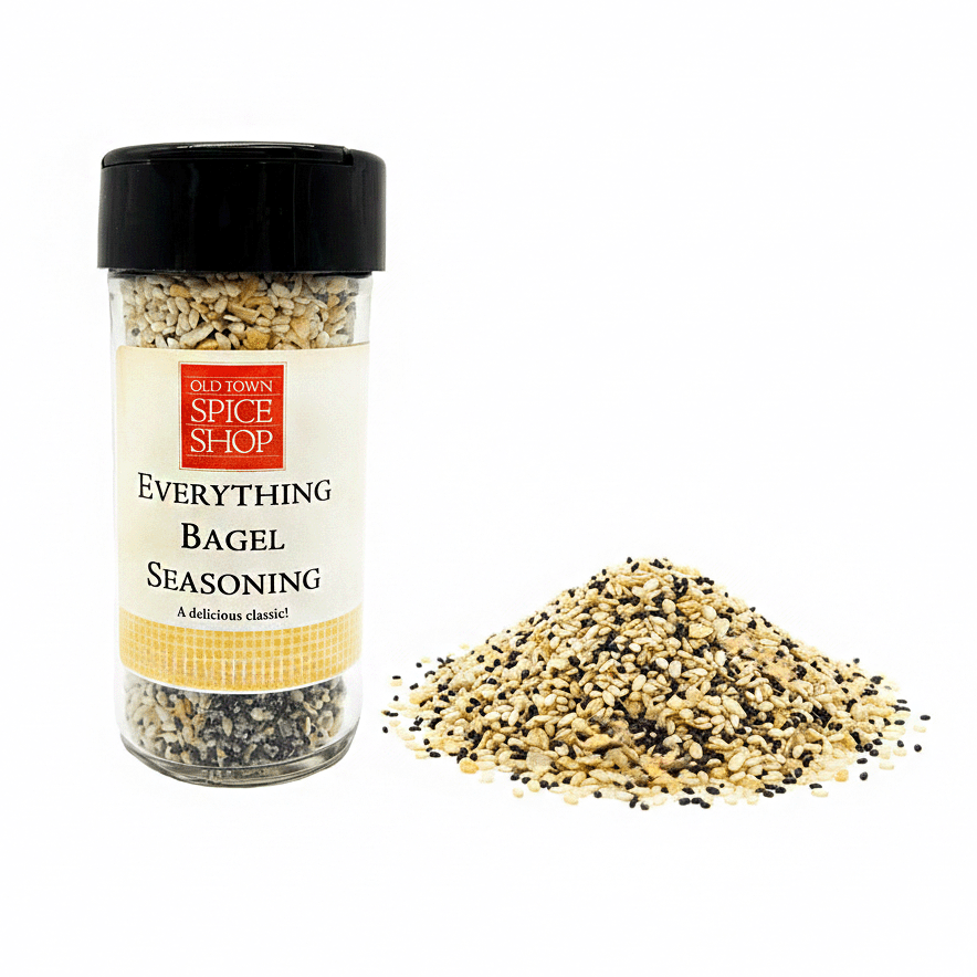 Jar of Old Town Spice Shop Everything Bagel Seasoning with spilled contents on a white background