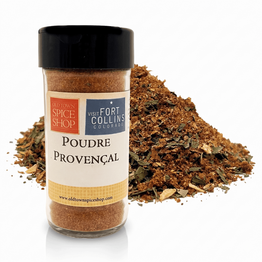 Jar of Poudre Provençal spice with visible herbs on a white background