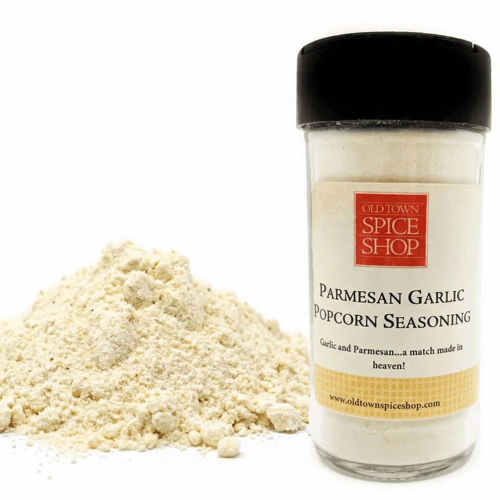 Jar of Parmesan Garlic Popcorn Seasoning from Old Town Spice Shop with a pile of seasoning on a white background.
