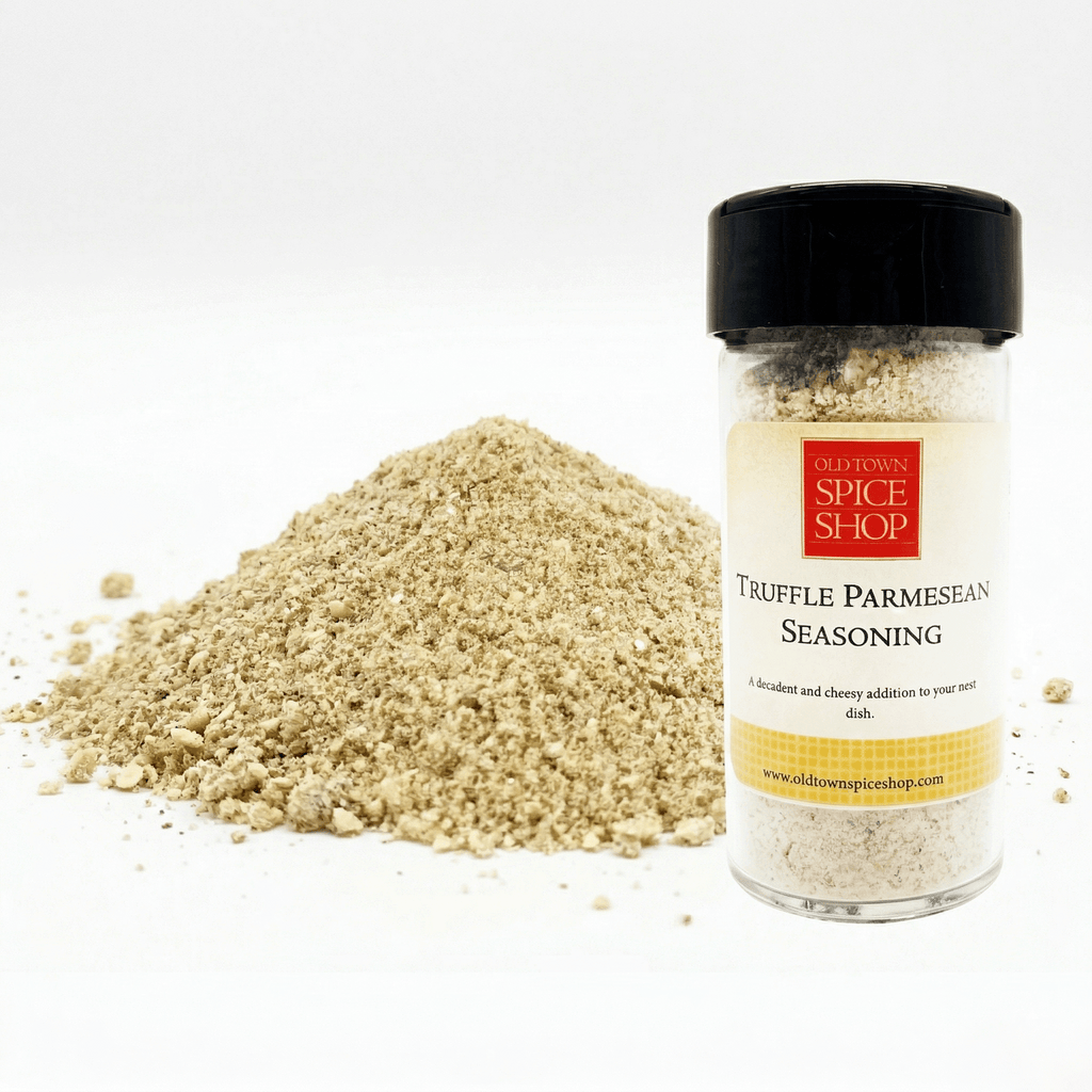 Truffle Parmesan seasoning jar with a pile of seasoning on a white background