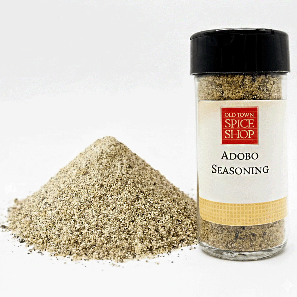 Jar of Old Town Spice Shop Adobo Seasoning with spilled seasoning on a white background