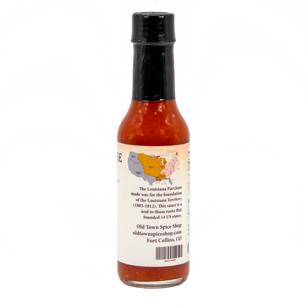 Hot sauce bottle with label on a white background