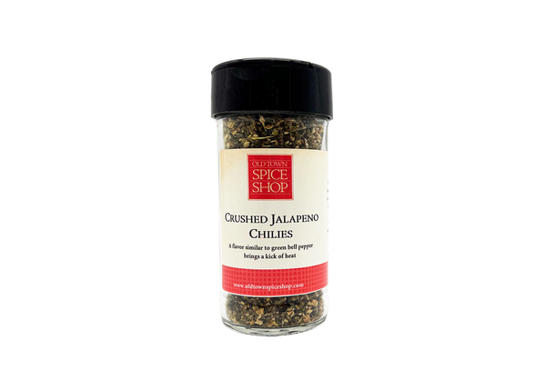 Spice jar labeled 'Old Town Spice Shop' with crushed jalapeno chilies on a white background