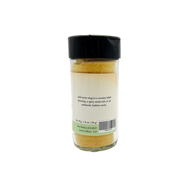 Spice container with a black lid on a white background