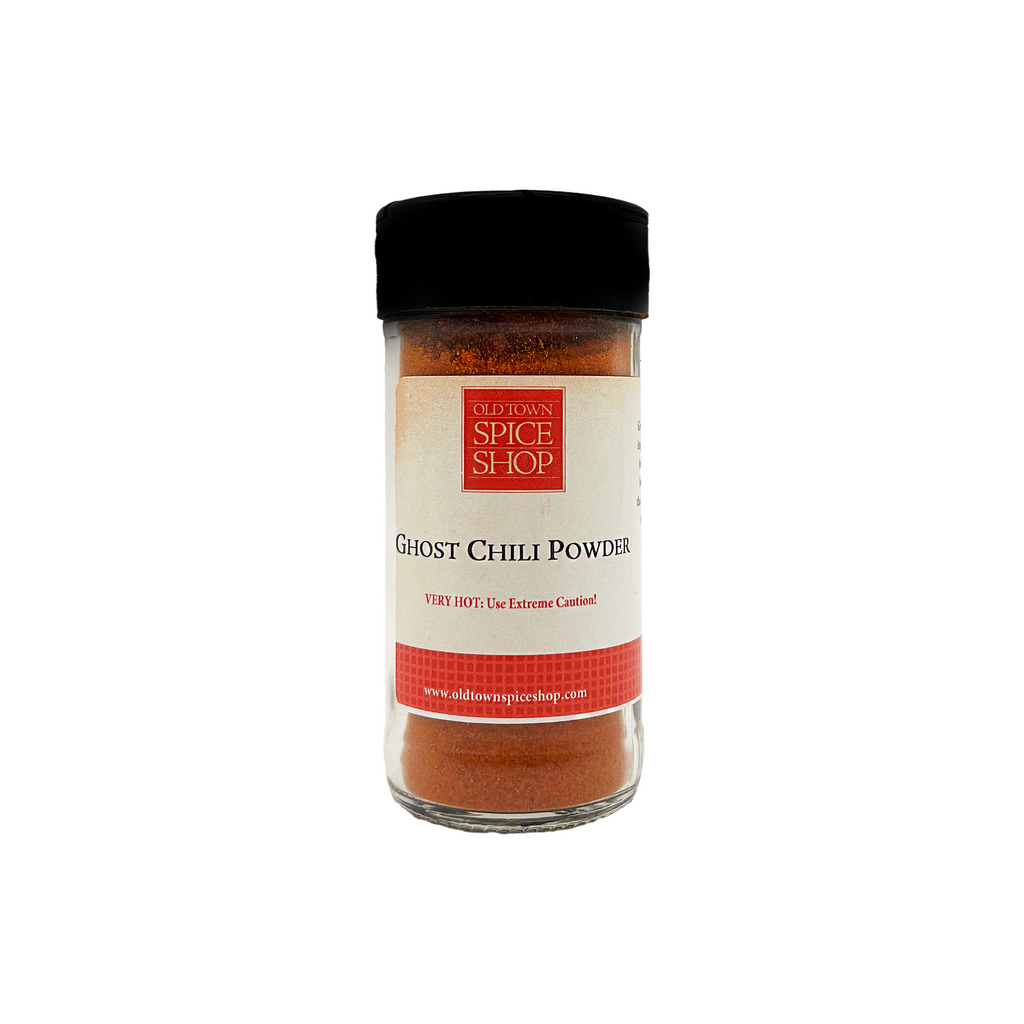 Jar of ghost chili powder on a white background