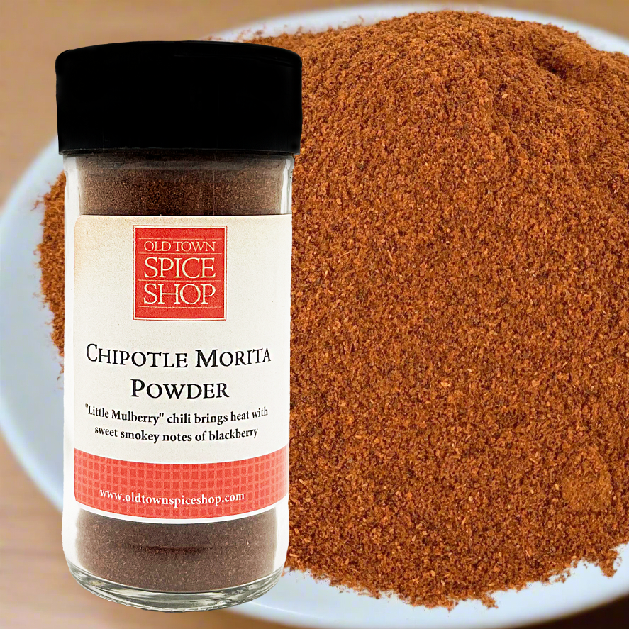 Jar of chipotle morita powder from Old Town Spice Shop on a plate with powder.