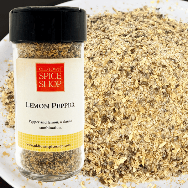 Jar of Old Town Spice Shop Lemon Pepper with spilled spice on a white plate