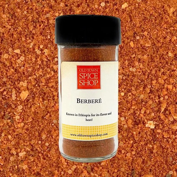 Bottle of Old Town Spice Shop Berbere spice on a textured red background